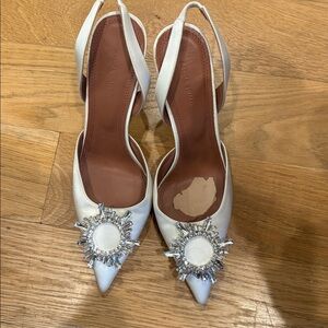 Amina Muaddi White Satin Slingback Heels with Crystal Sunburst